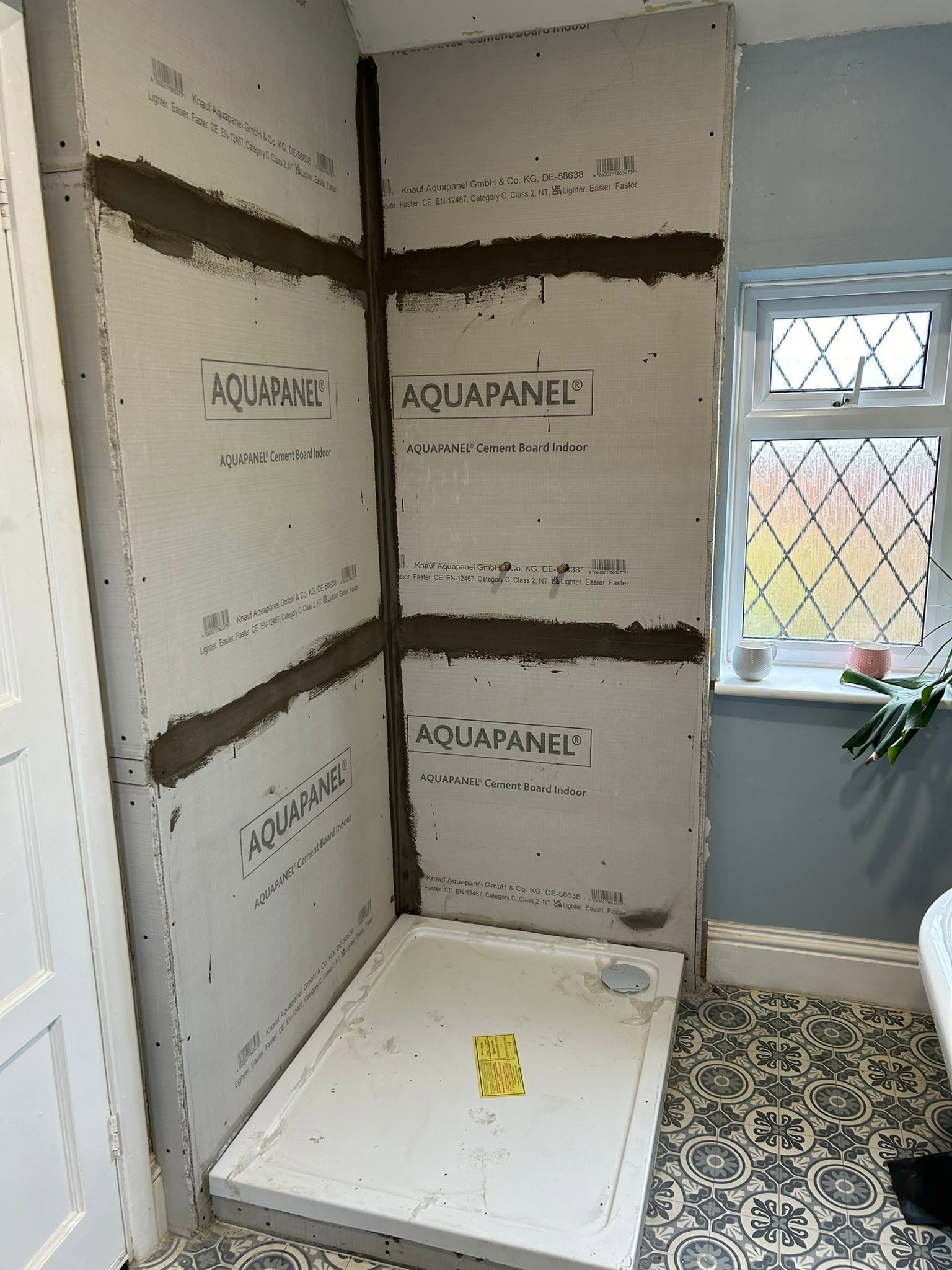 Boards up: Cement backer boards fixed and sealed at the joints.