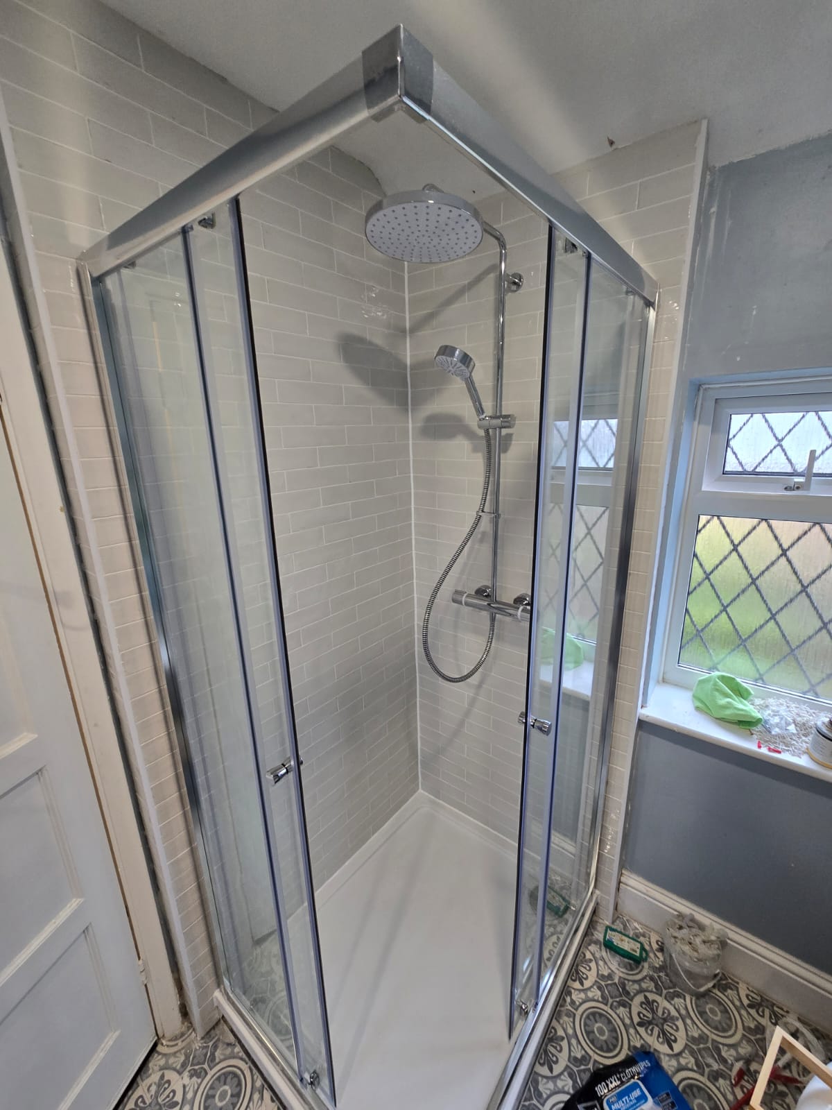Finished: Corner enclosure and rainfall shower fitted.